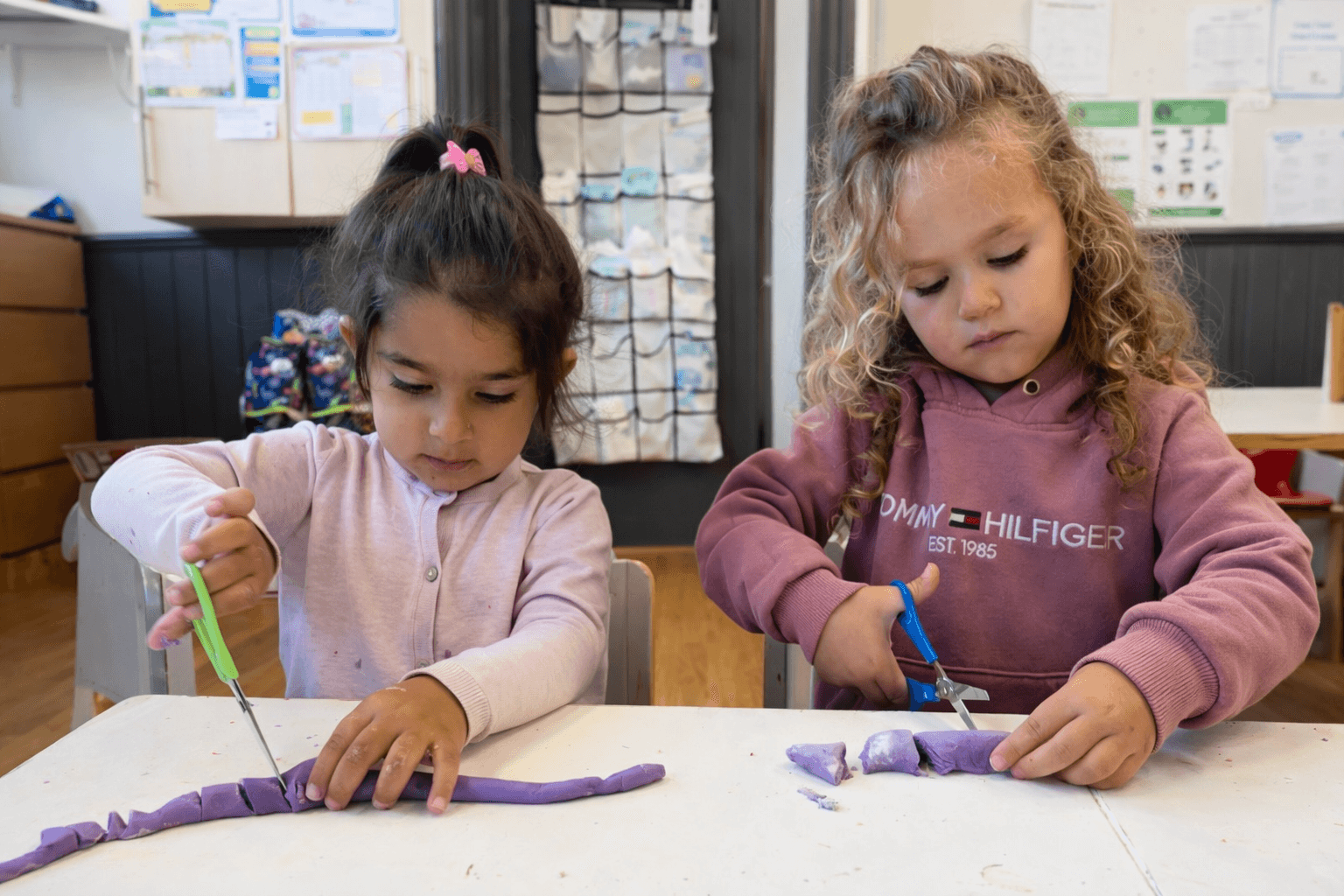 Children enjoying messy play and role play activities
