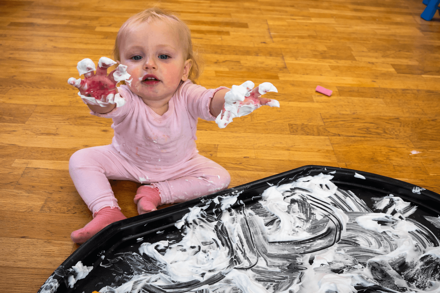 Children during circle time with nursery practitioner